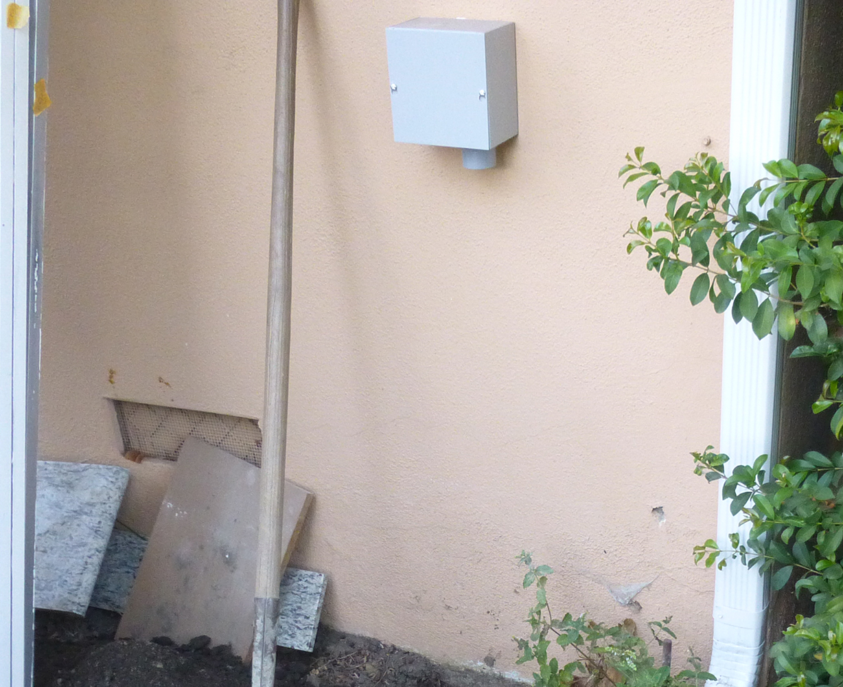 Pull box mounted on external wall